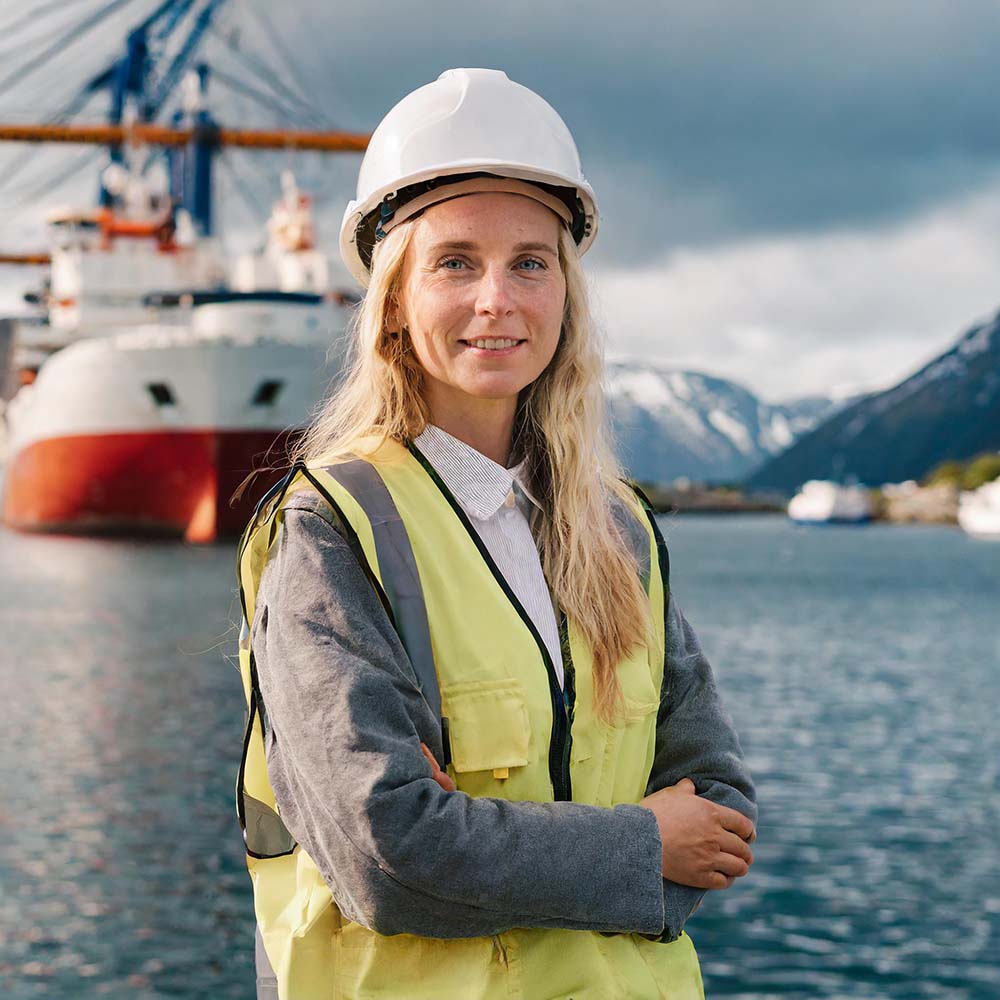 AI Image of an electro engineer standing in front of a ship AI Image of an electro engineer standing in front of a ship