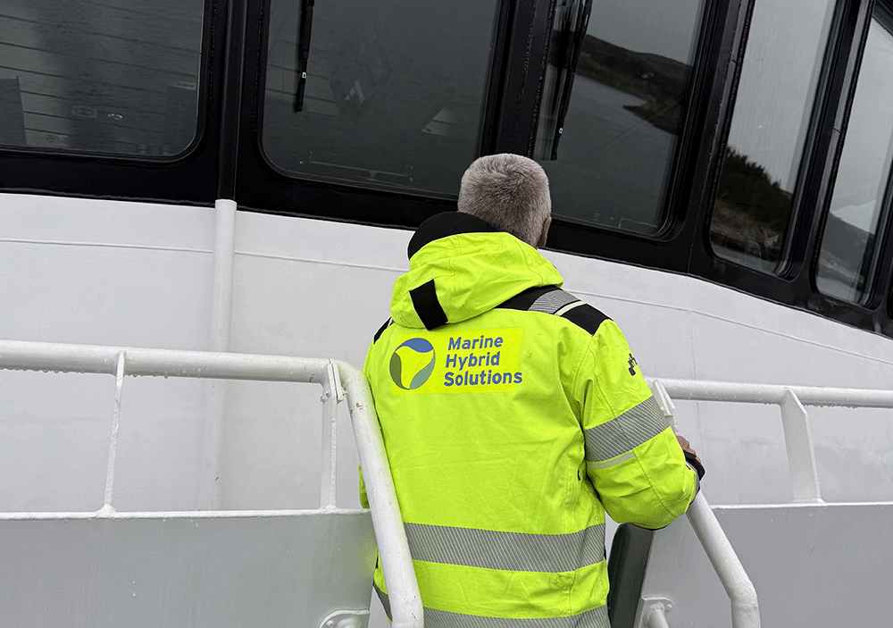Employee standing on a boat
