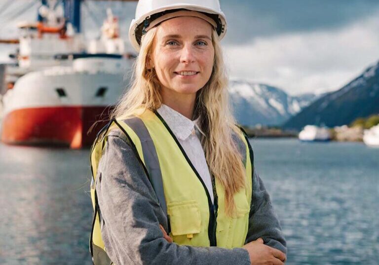 AI Image of an electro engineer standing in front of a ship