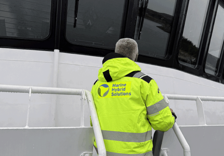 Employee standing on a boat